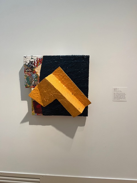 An abstract work that combines paint with sculpture.